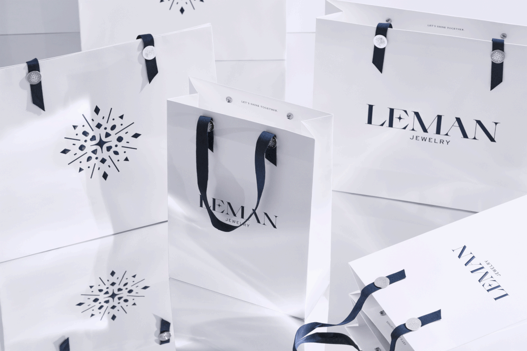 Row of premium shopping bags lined up neatly inside the Leman Jewelry boutique.