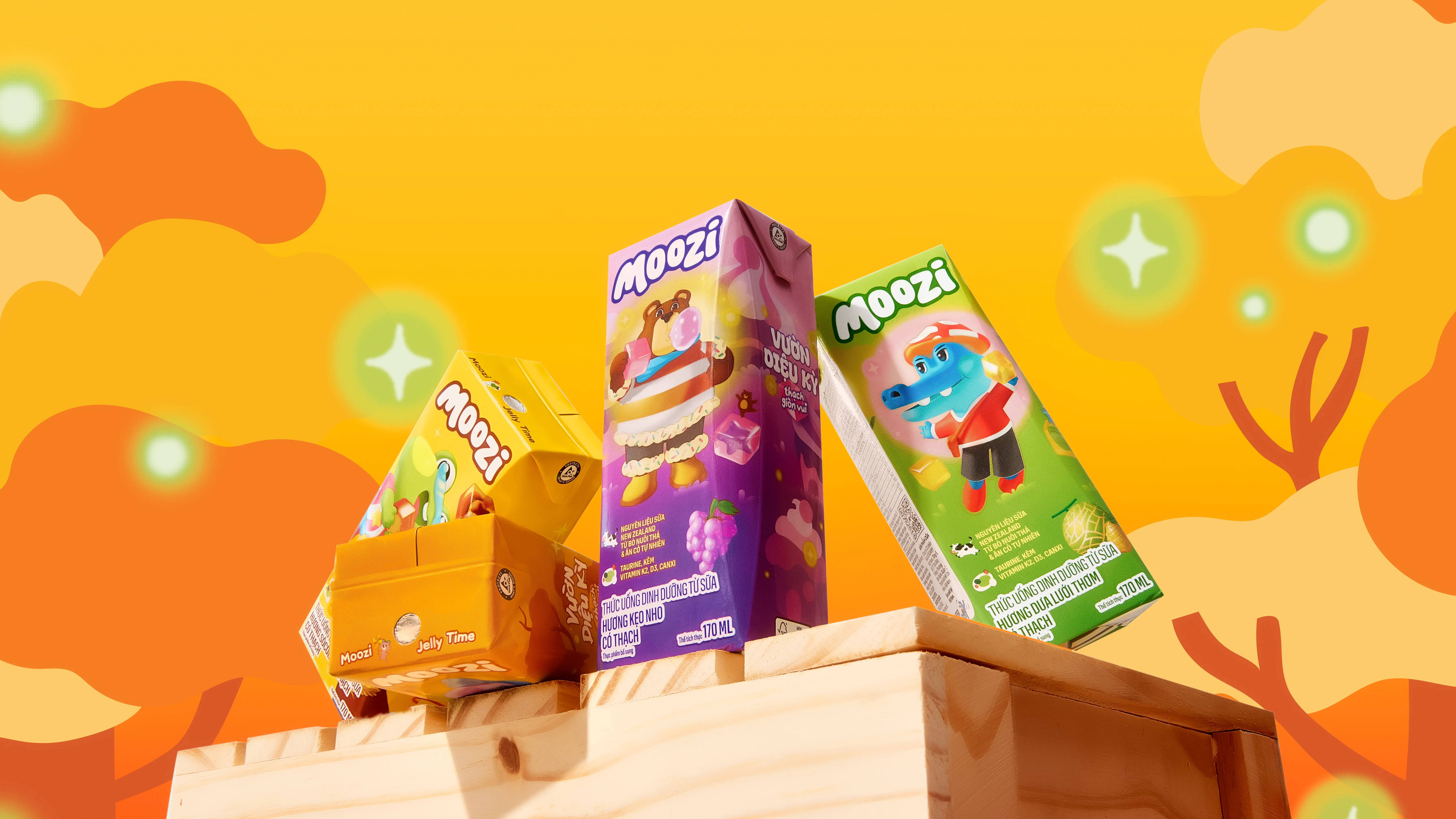 Display of colorful Moozi product boxes arranged against a warm yellow background.